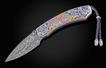 Hand engraved William Henry knife with damascus steel blade