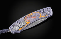 Hand engraved William Henry knife with damascus steel blade