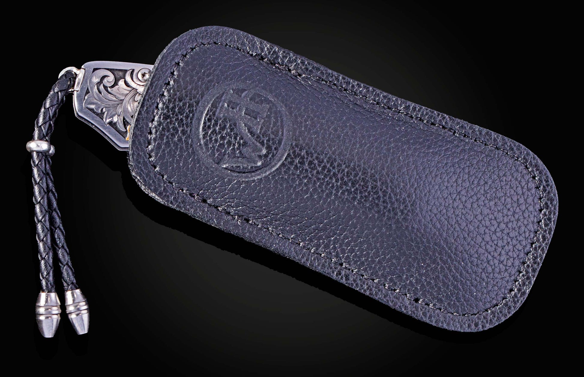 Hand engraved William Henry knife with damascus steel blade