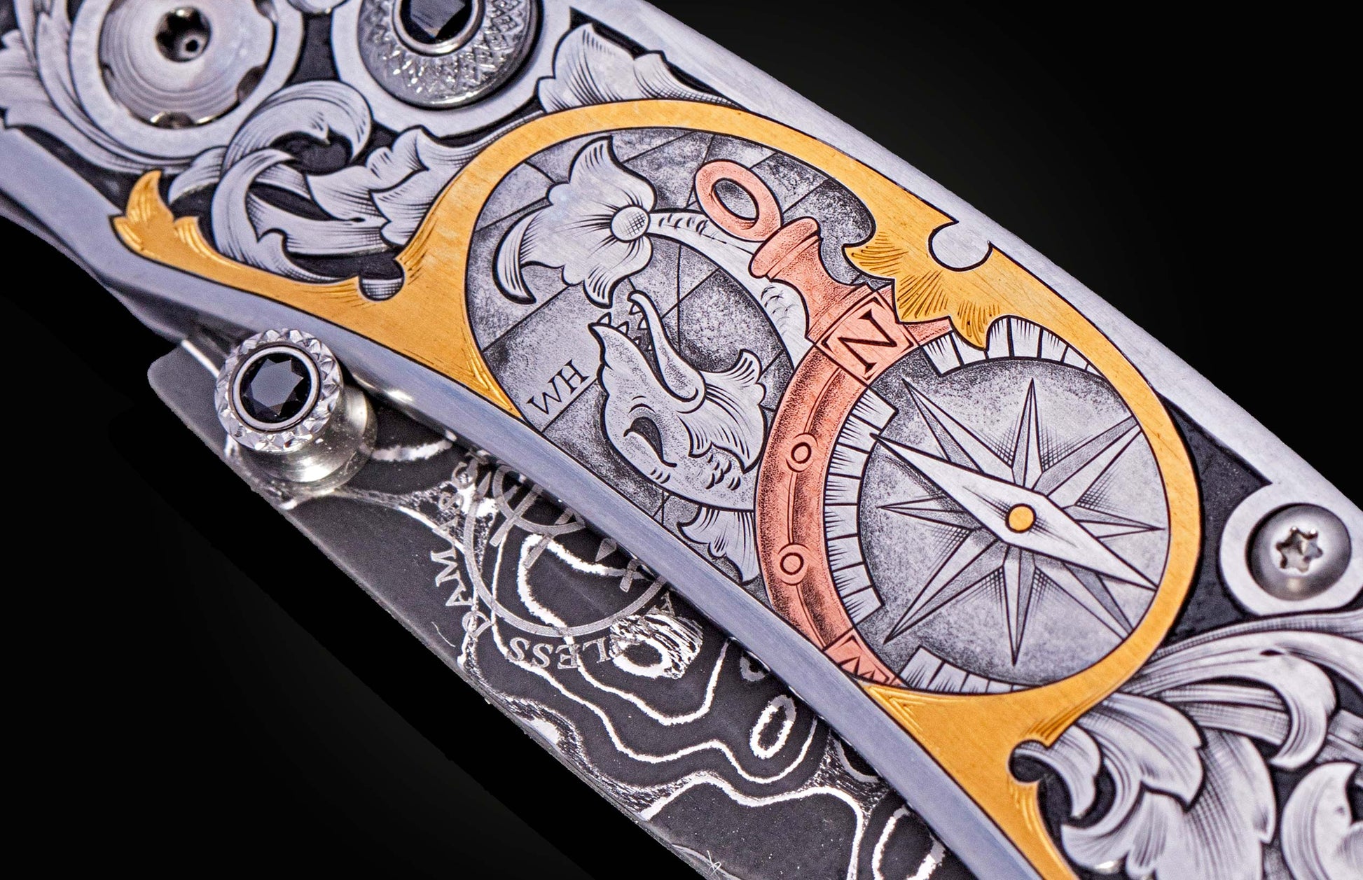 Hand engraved William Henry knife with damascus steel blade