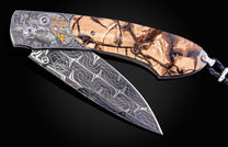 Hand engraved knife with Alaskan game animals, wooly mammoth tusk and damascus steel