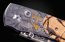 Hand engraved knife with Alaskan game animals, wooly mammoth tusk and damascus steel