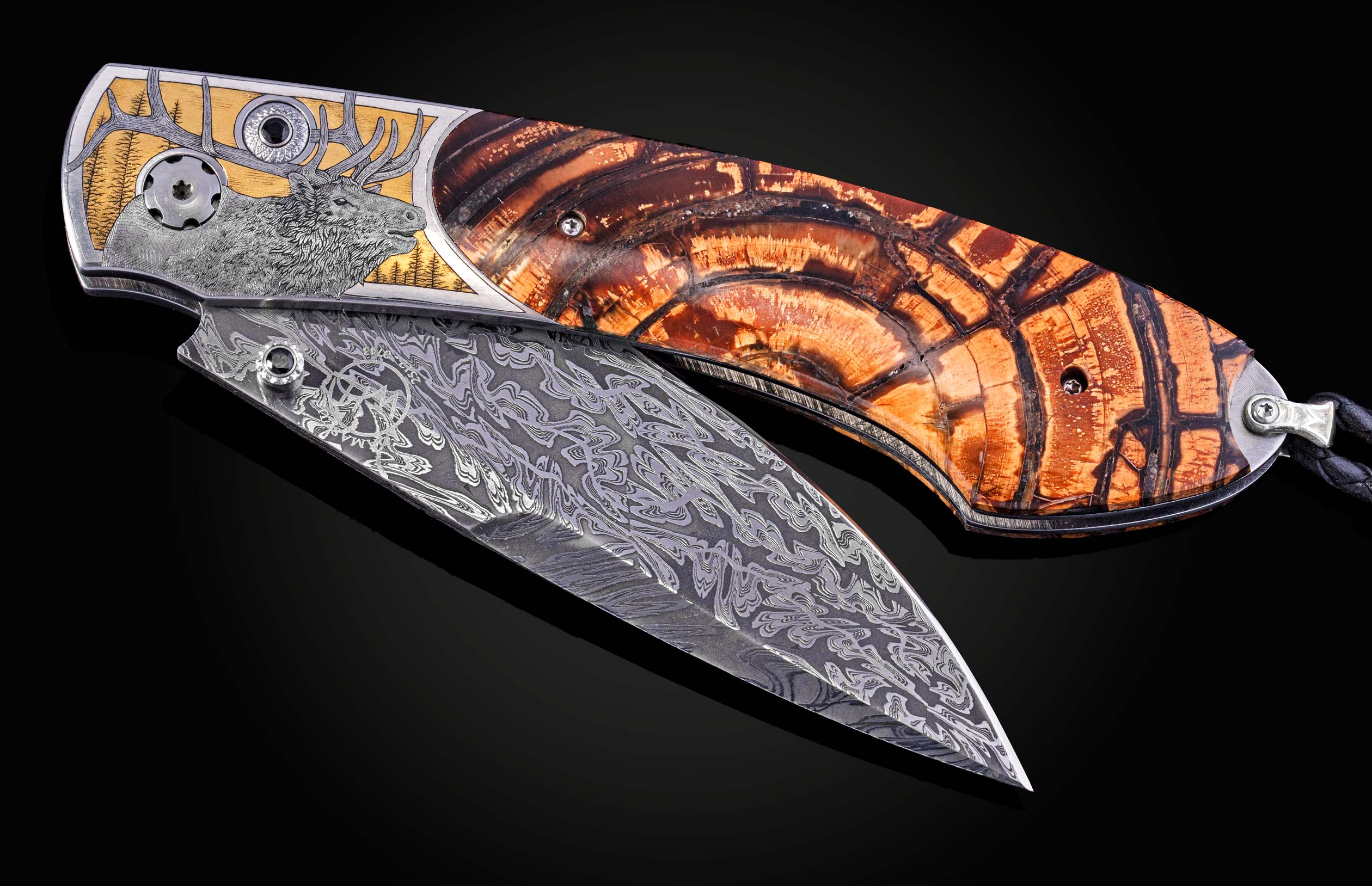 Hand engraved William Henry knife depicting an Elk with fossil woolly mammoth tusk and damascus steel