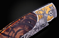 Hand engraved William Henry knife depicting an Elk with fossil woolly mammoth tusk and damascus steel