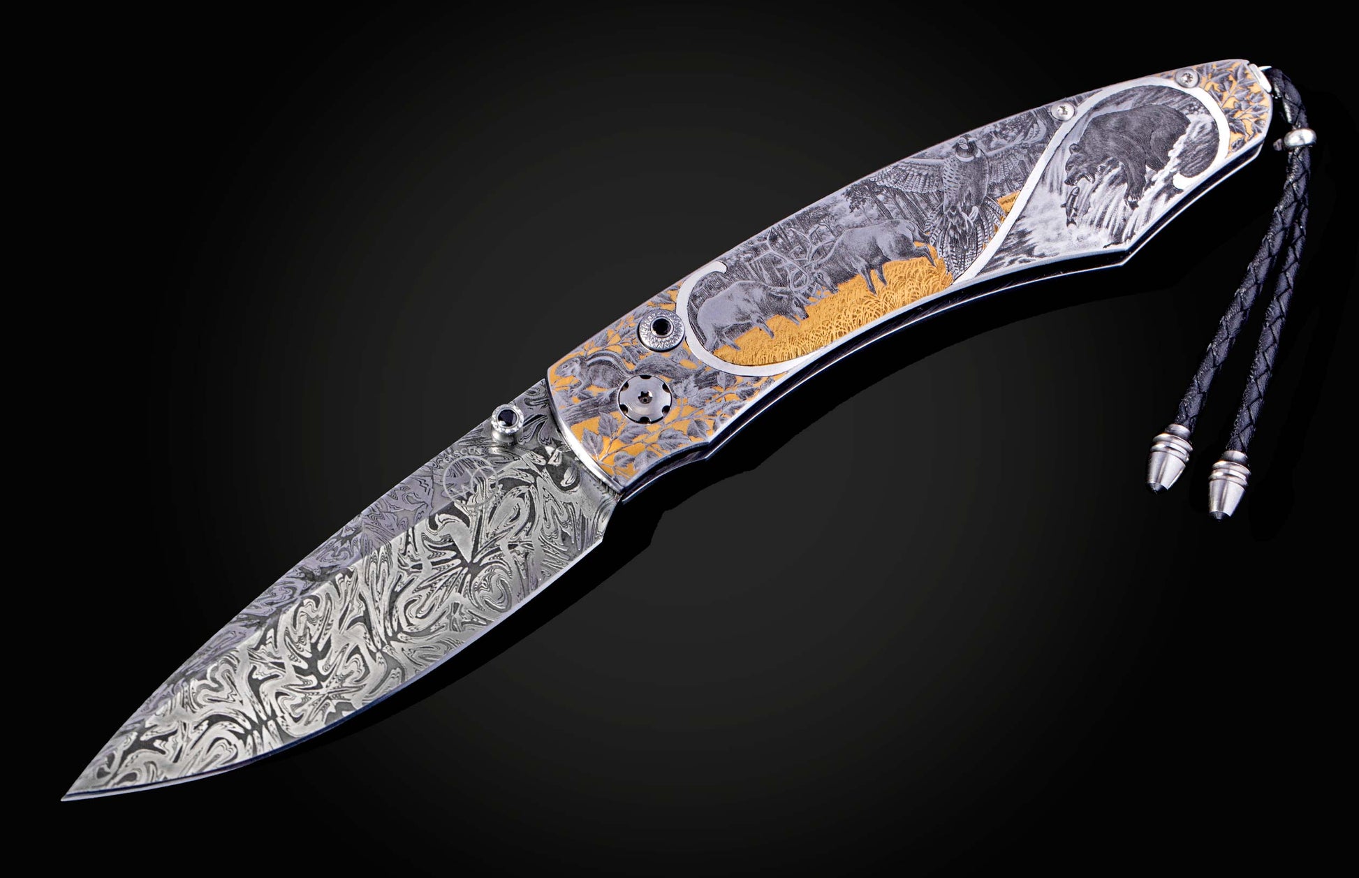 Hand engraved William Henry knife depicting anmals