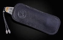 Hand engraved William Henry knife depicting anmals