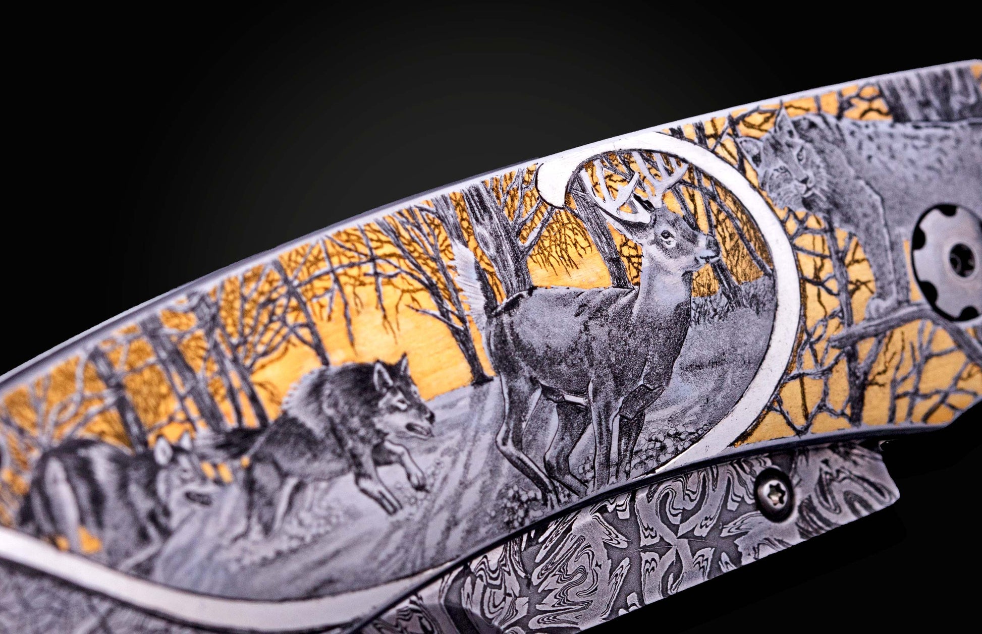 Hand engraved William Henry knife depicting anmals