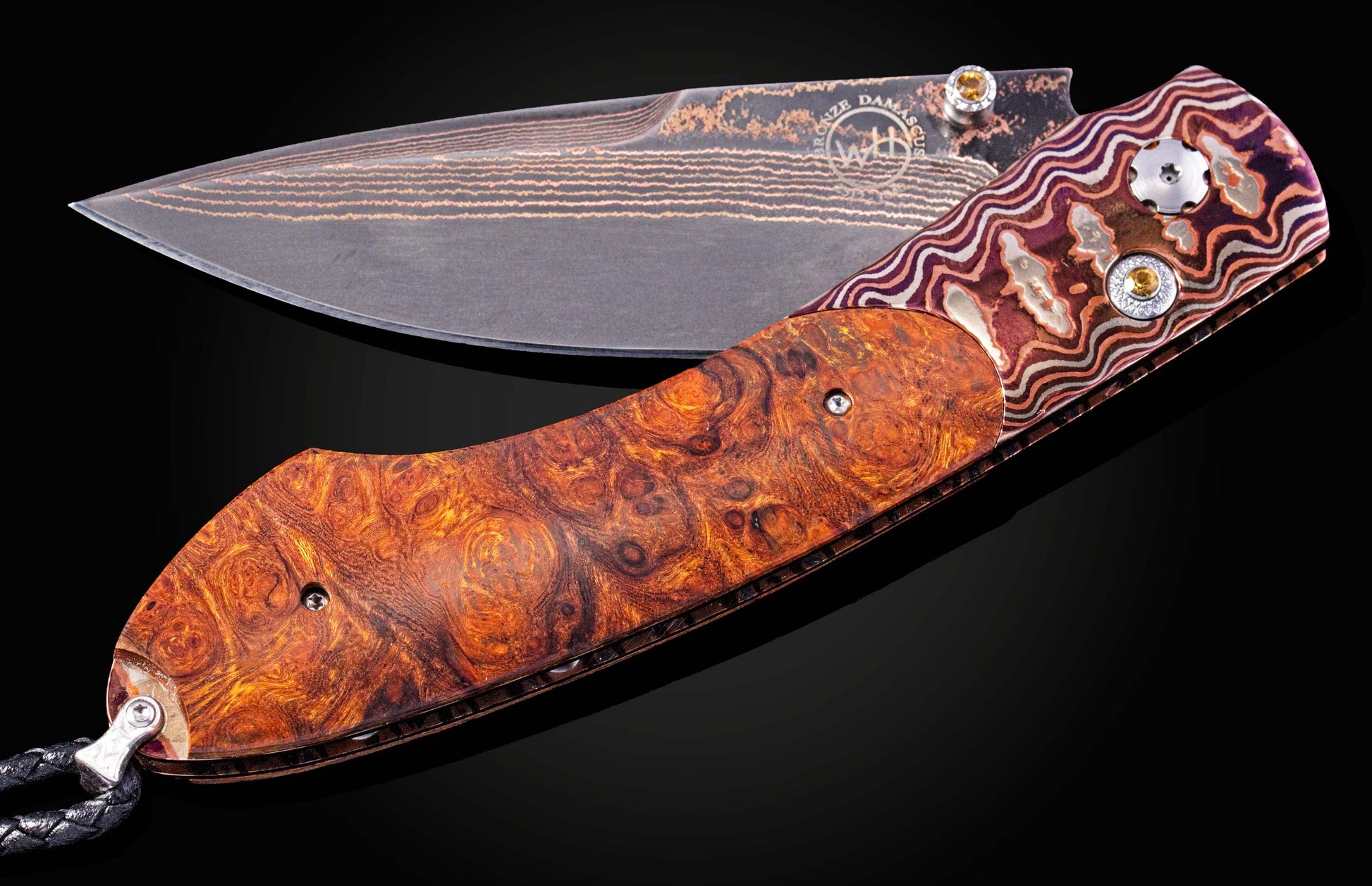 Folding knife with a decorative handle on a black background