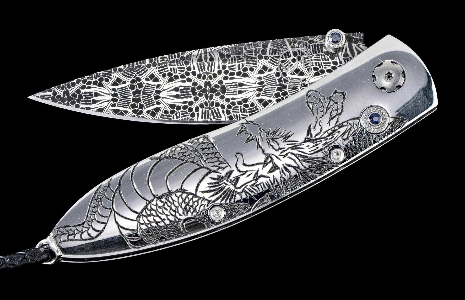 One of a kind custom William Henry Knife with hand-forged Damascus steel, hand-carved sterling silver, and sapphire.