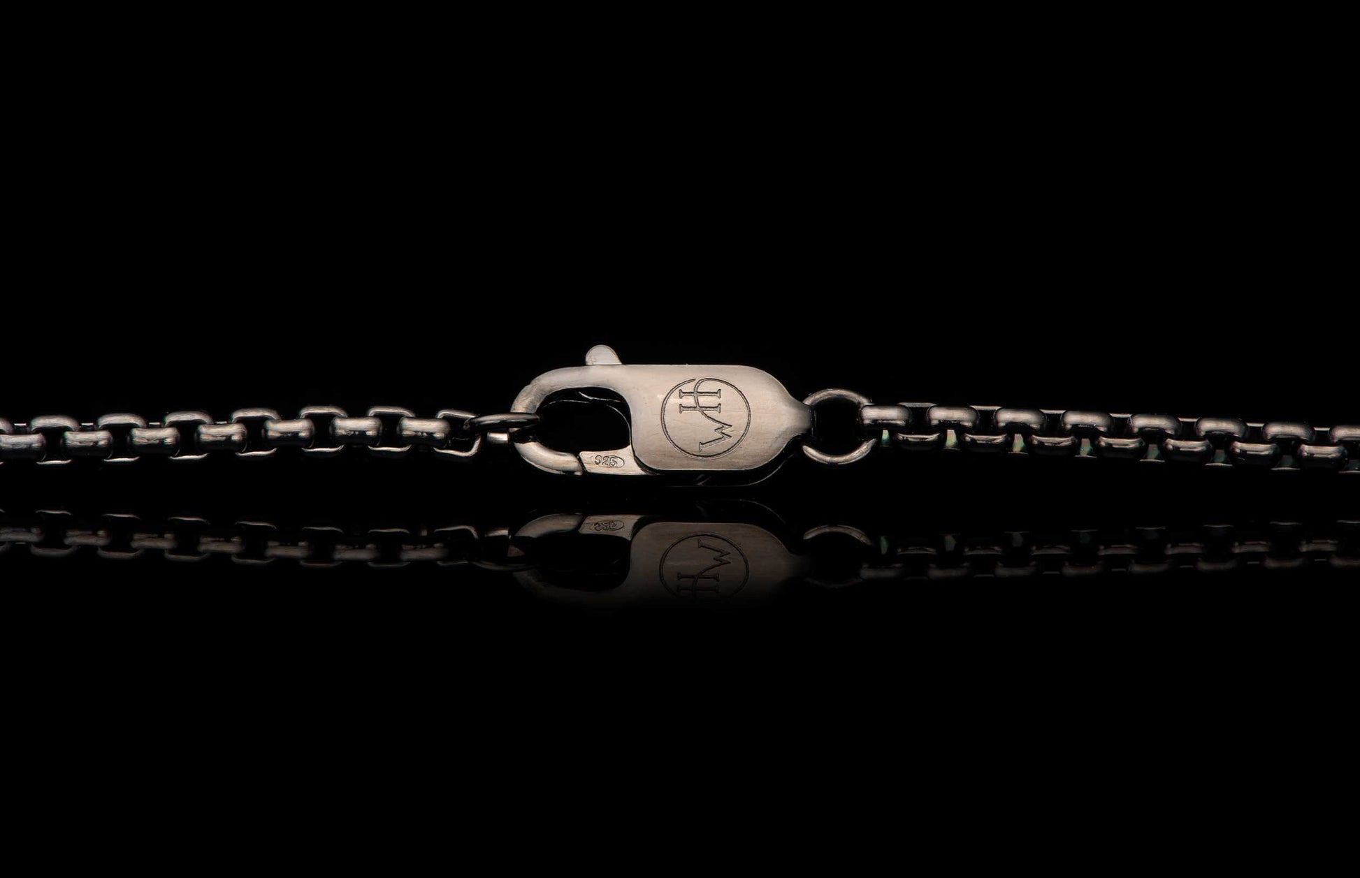 Black Box Chain men's jewelry from William Henry is bronze with black PVD coating for easy care and durability. Image shows a detail shot of the custom William Henry latch.