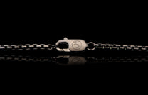 Black Box Chain men's jewelry from William Henry is bronze with black PVD coating for easy care and durability. Image shows a detail shot of the custom William Henry latch.