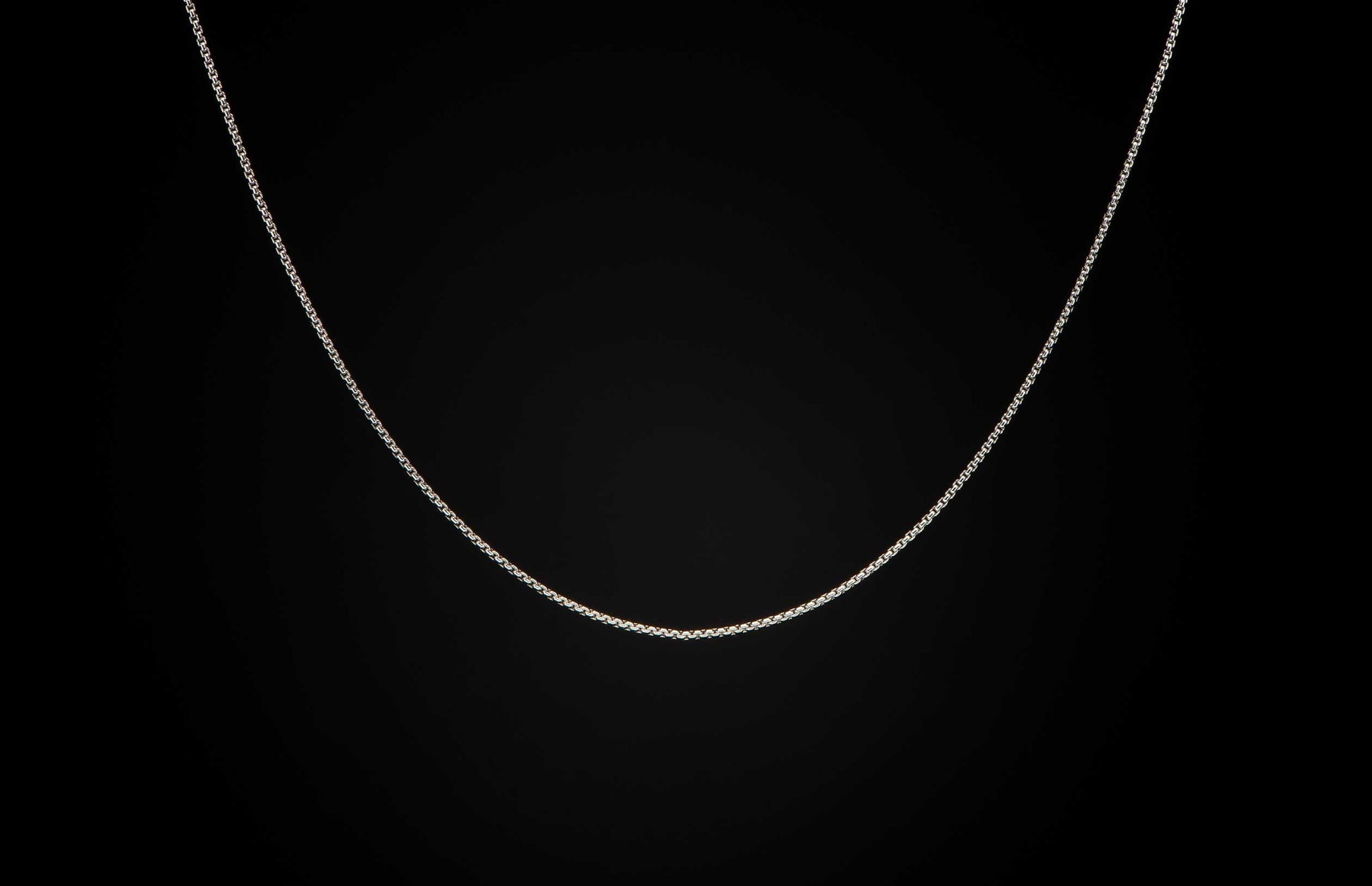 Sterling silver Box Chain necklace men's jewelry from William Henry. Chain is displayed on a black background.
