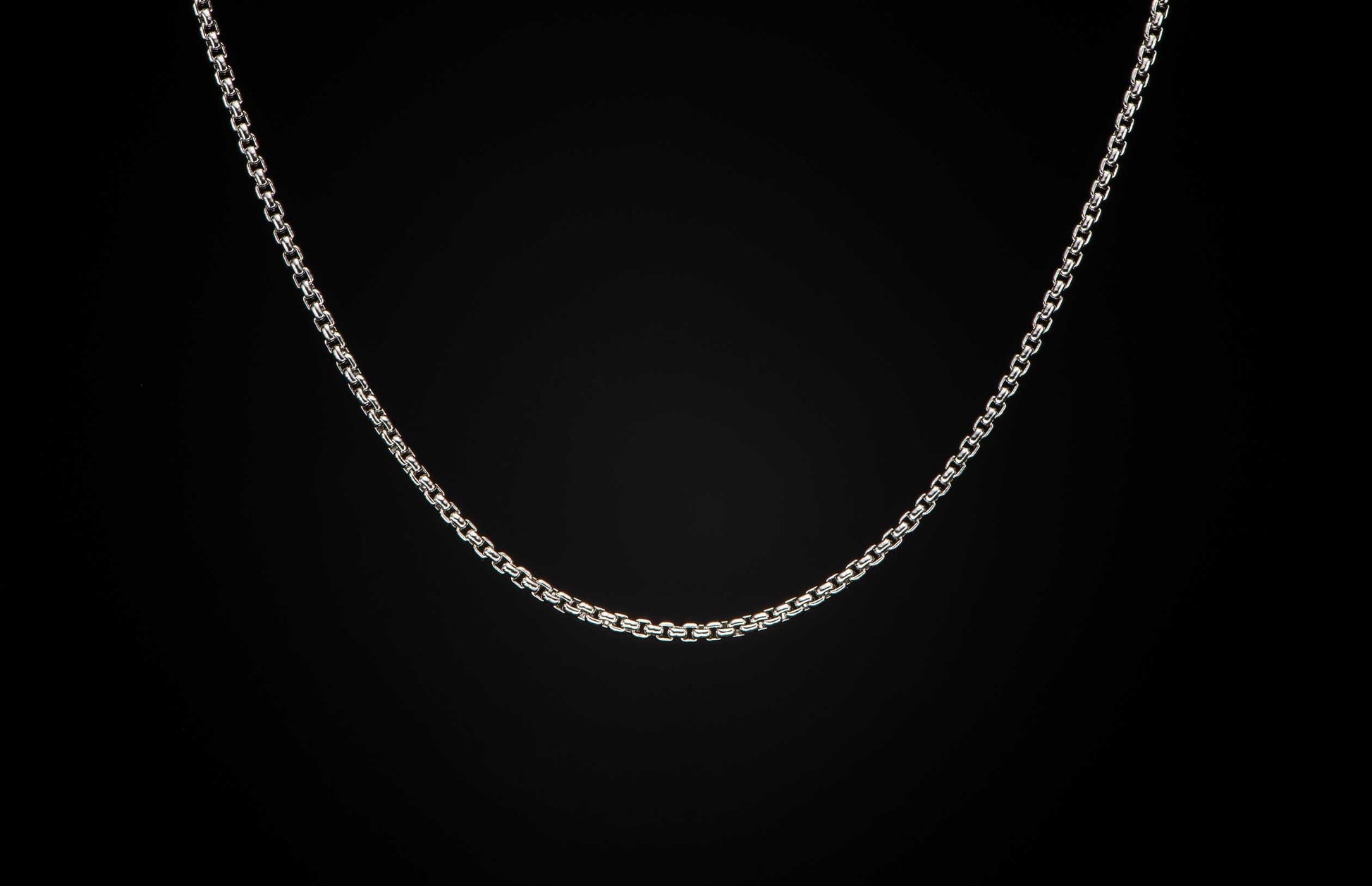 Sterling silver Box Chain necklace men's jewelry from William Henry. Chain is displayed on a black background.