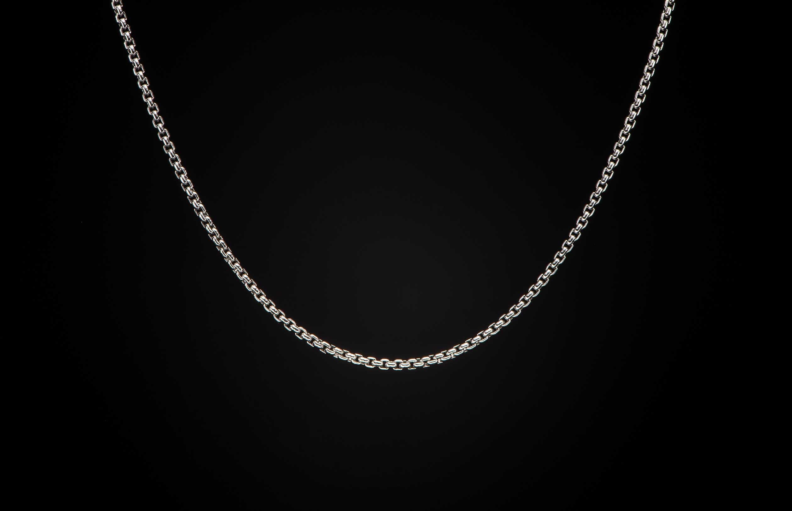 Sterling silver Box Chain necklace men's jewelry from William Henry. Chain is displayed on a black background.