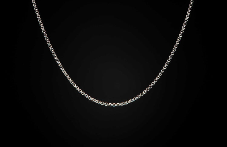 Sterling silver Box Chain necklace men's jewelry from William Henry. Chain is displayed on a black background.
