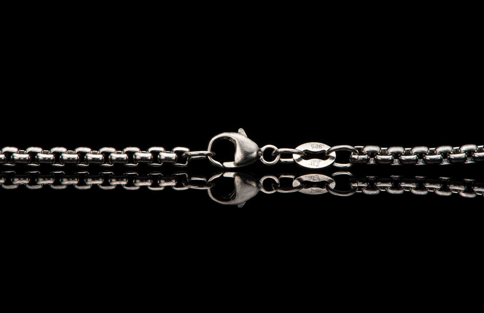Sterling silver Box Chain necklace men's jewelry from William Henry. Photo shows a detailed view of the custom William Henry latch.