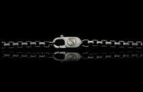 Black Box Chain men's jewelry from William Henry is bronze with black PVD coating for easy care and durability. Image is a detail photo showing the custom William Henry latch.
