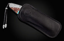 The Desert Blues Turquoise and Titanium Pocket Knife in a leather case