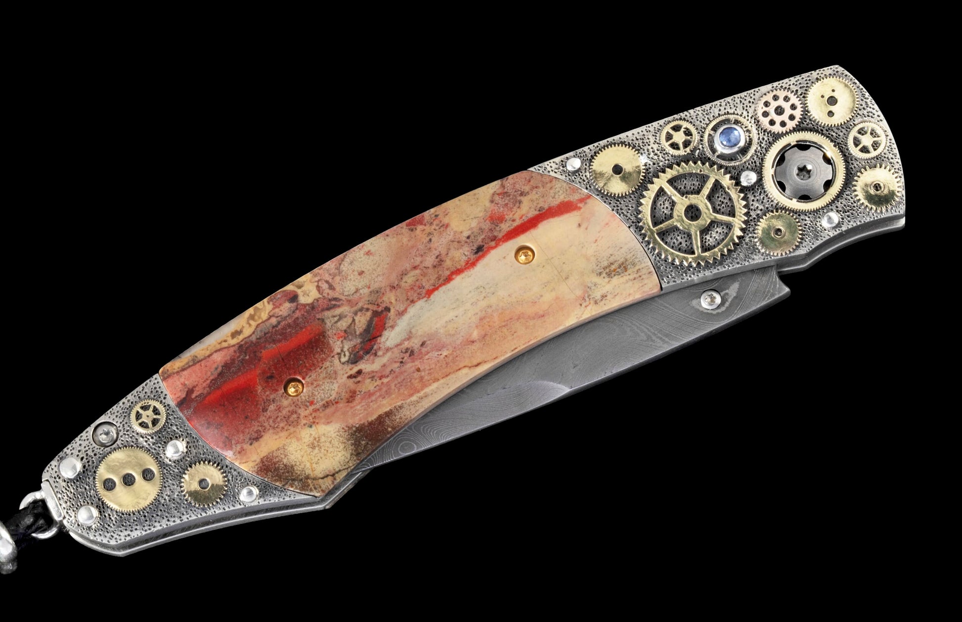 Folding knife with a reddish-beige stone handle, embellished with silver and gold-tone gears, and a visible Damascus steel blade.