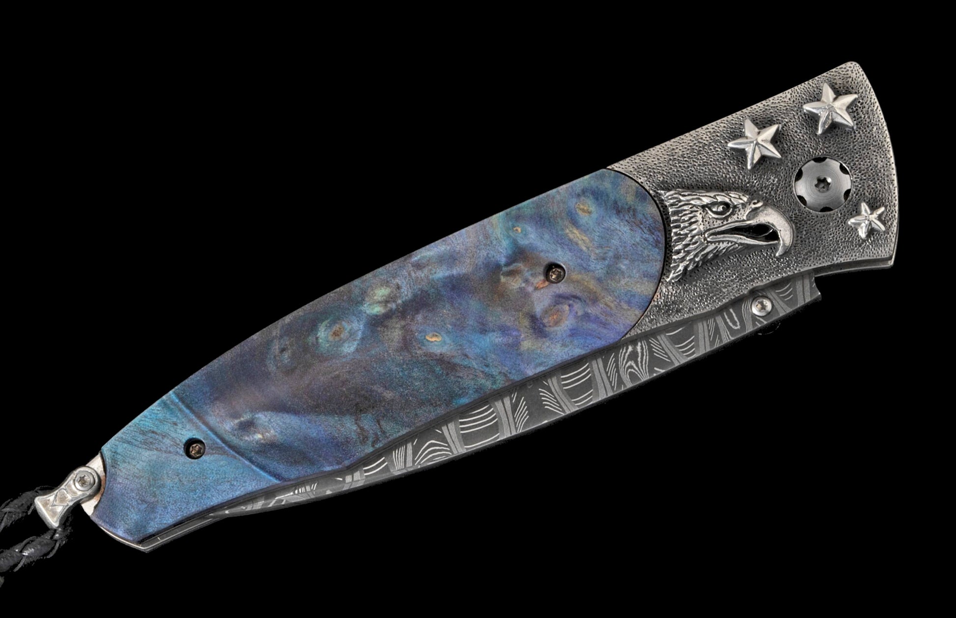 Folding knife with a swirling blue handle, ornate silver eagle head and stars, and a patterned Damascus-style frame.