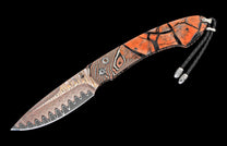 Knife with a wavy Damascus blade, an orange handle with cracked wood and striped resin sections, and a black braided leather cord.