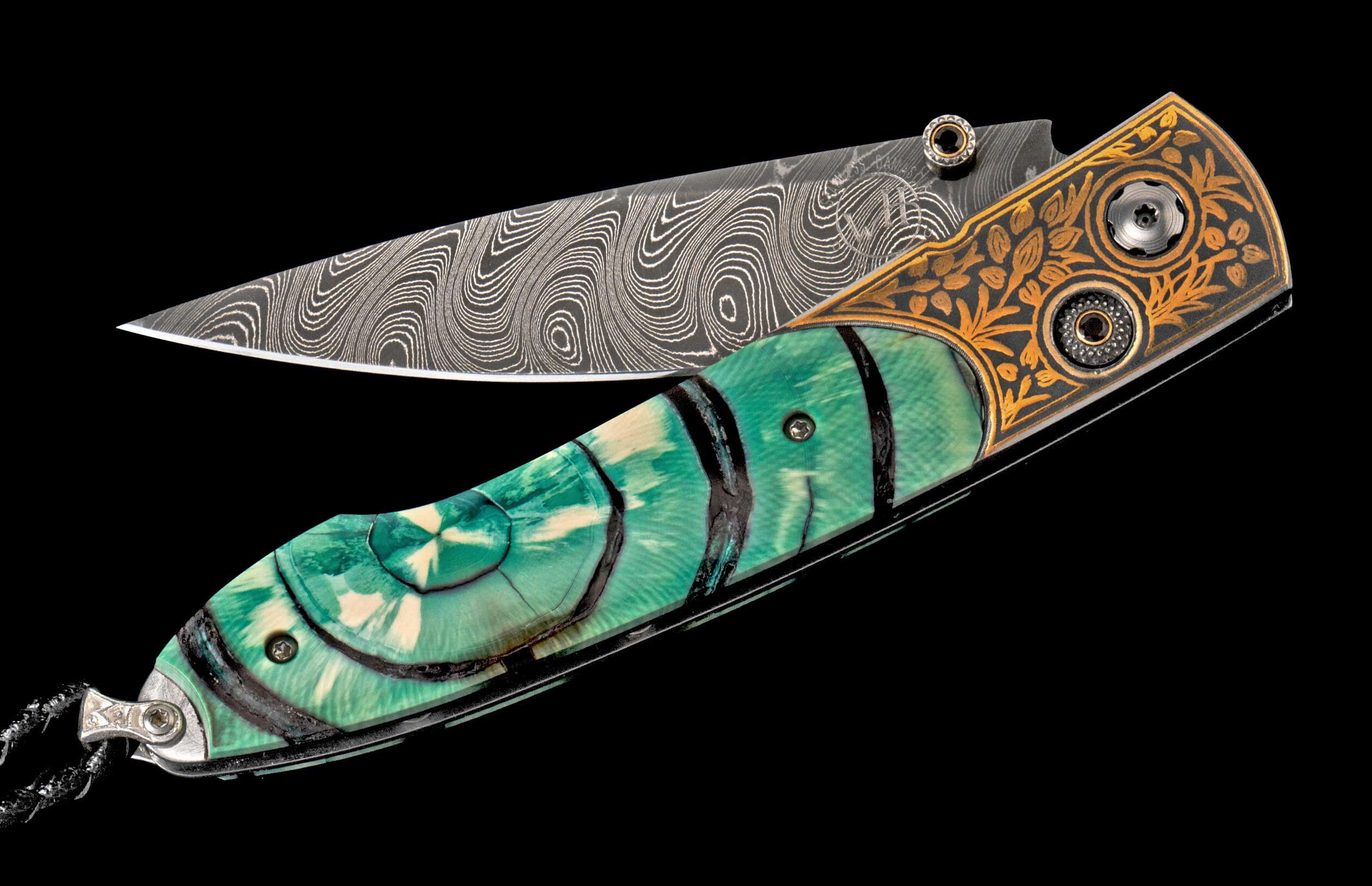 Folding knife with a swirling Damascus blade marked 'WH' and a green, white, and black swirled handle with gold floral etching on the end.