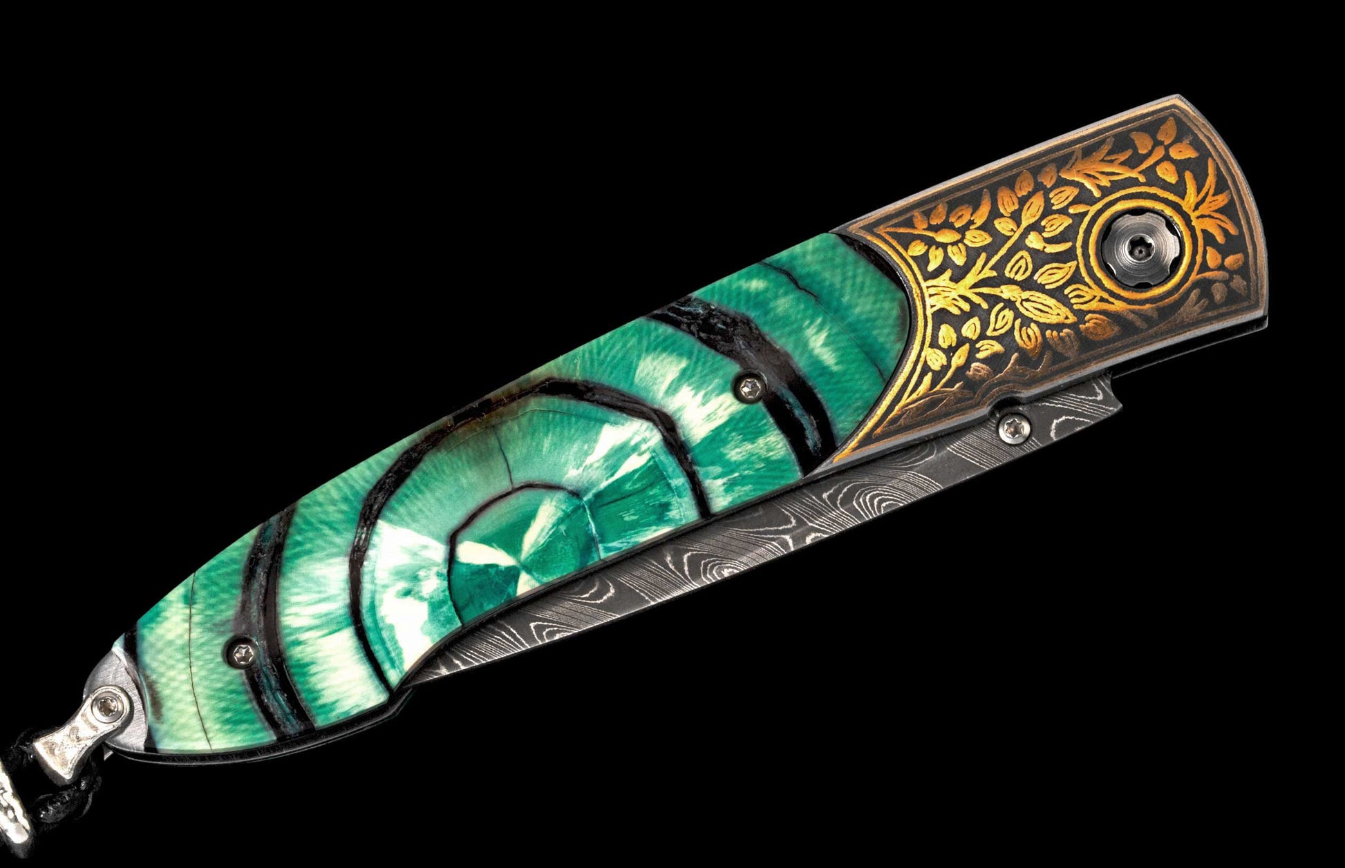Folding knife with a green and white concentric patterned handle, golden engraved bolster, and a Damascus steel blade.