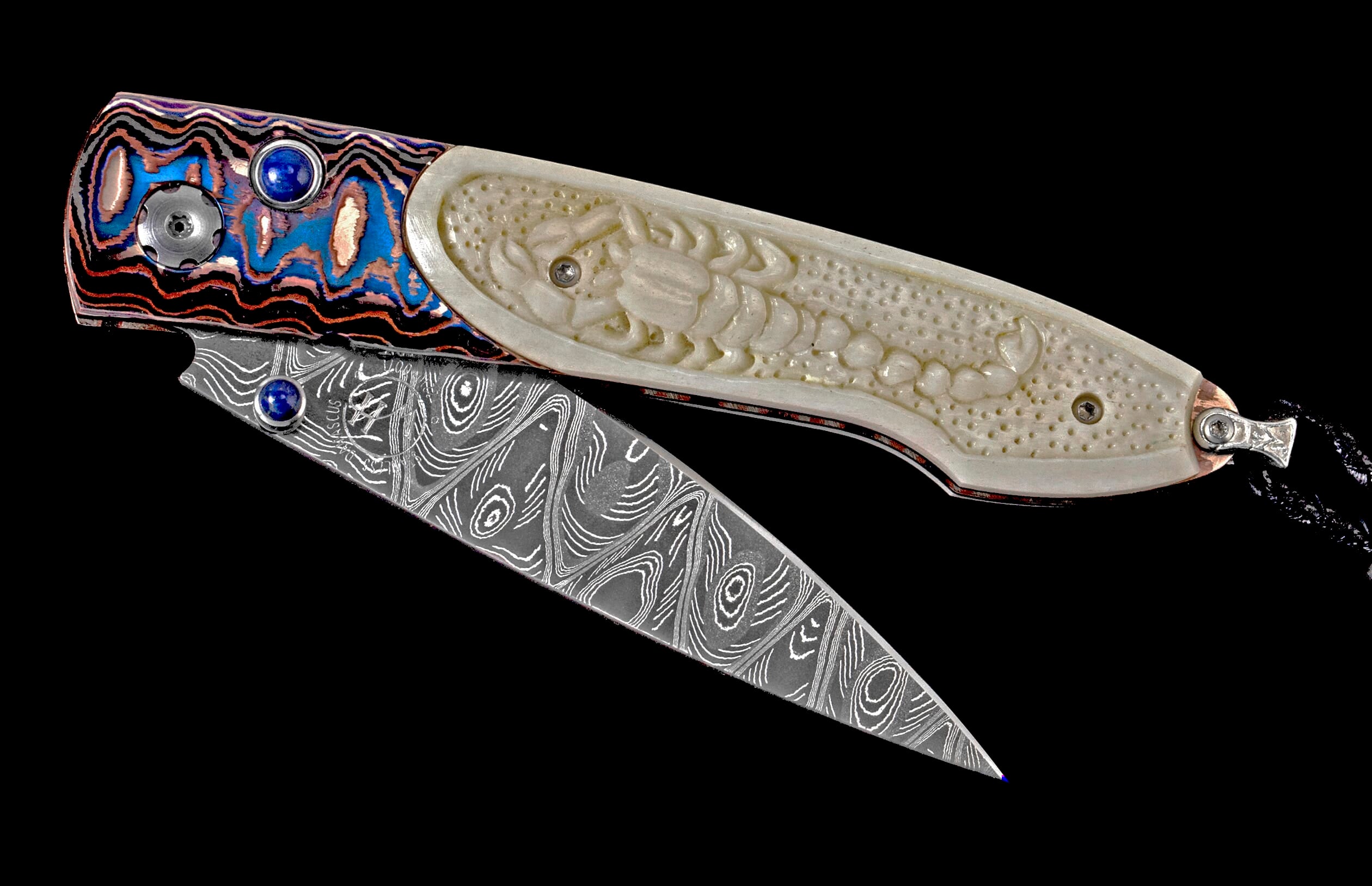 Ornate folding knife with a Damascus steel blade, a vibrant patterned handle with lapis lazuli, and a carved ivory scorpion.