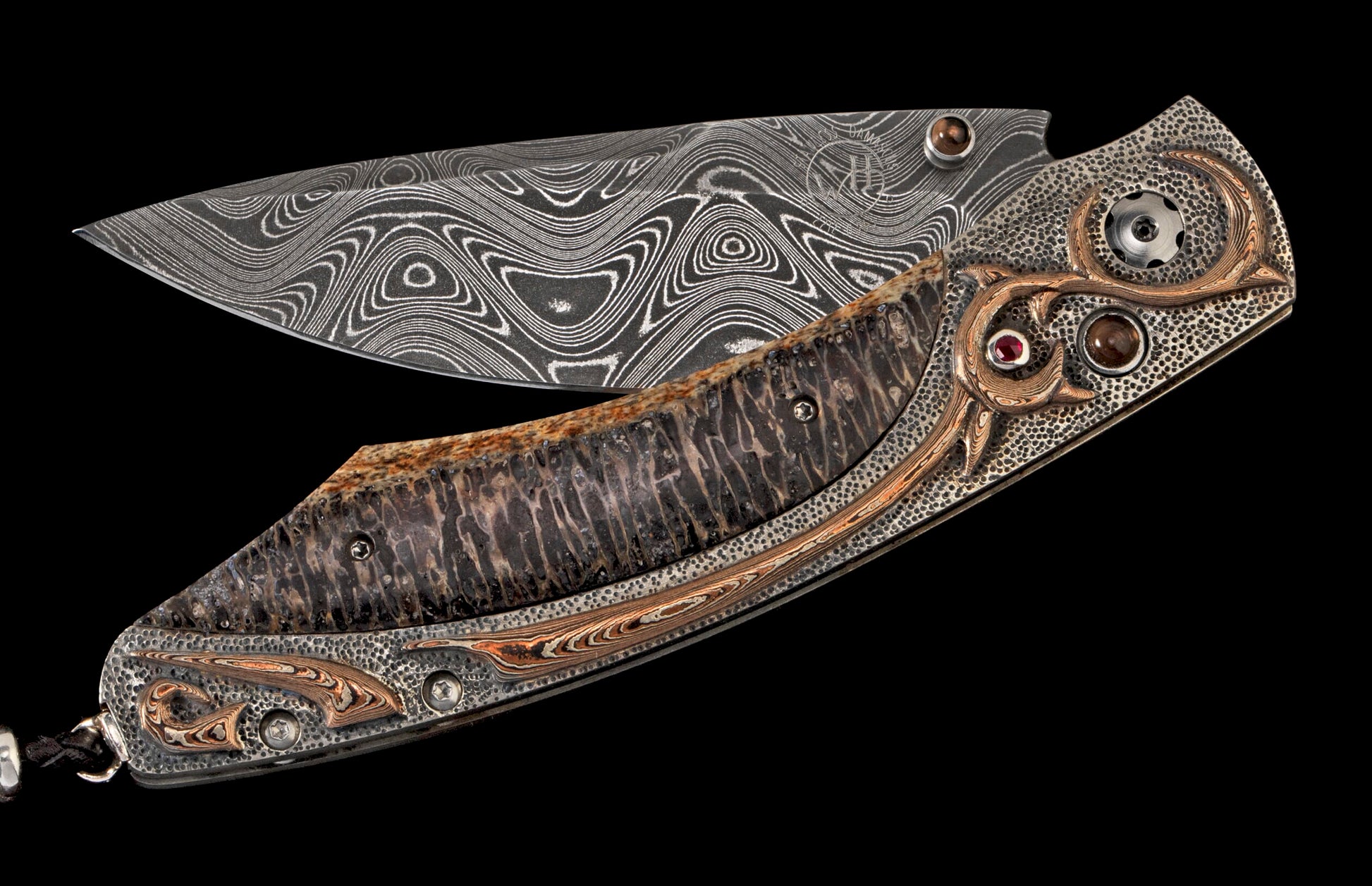 Ornate folding knife with wavy Damascus blade, textured handle, and decorative silver, copper, and gemstone accents.