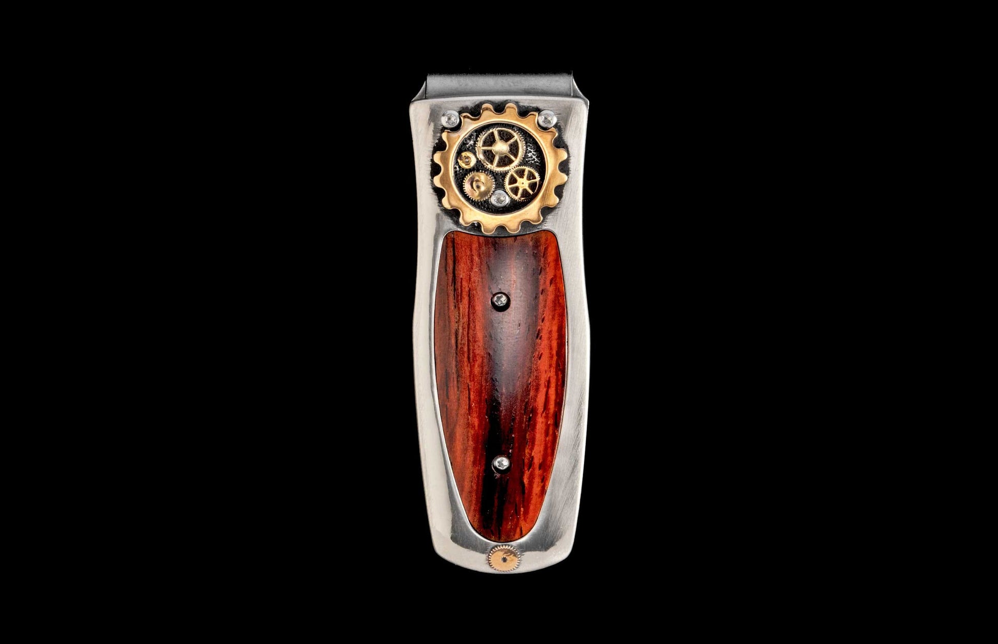 Steampunk money clip featuring silver metal, intricate gold gears, and a rich reddish-brown wood inlay.