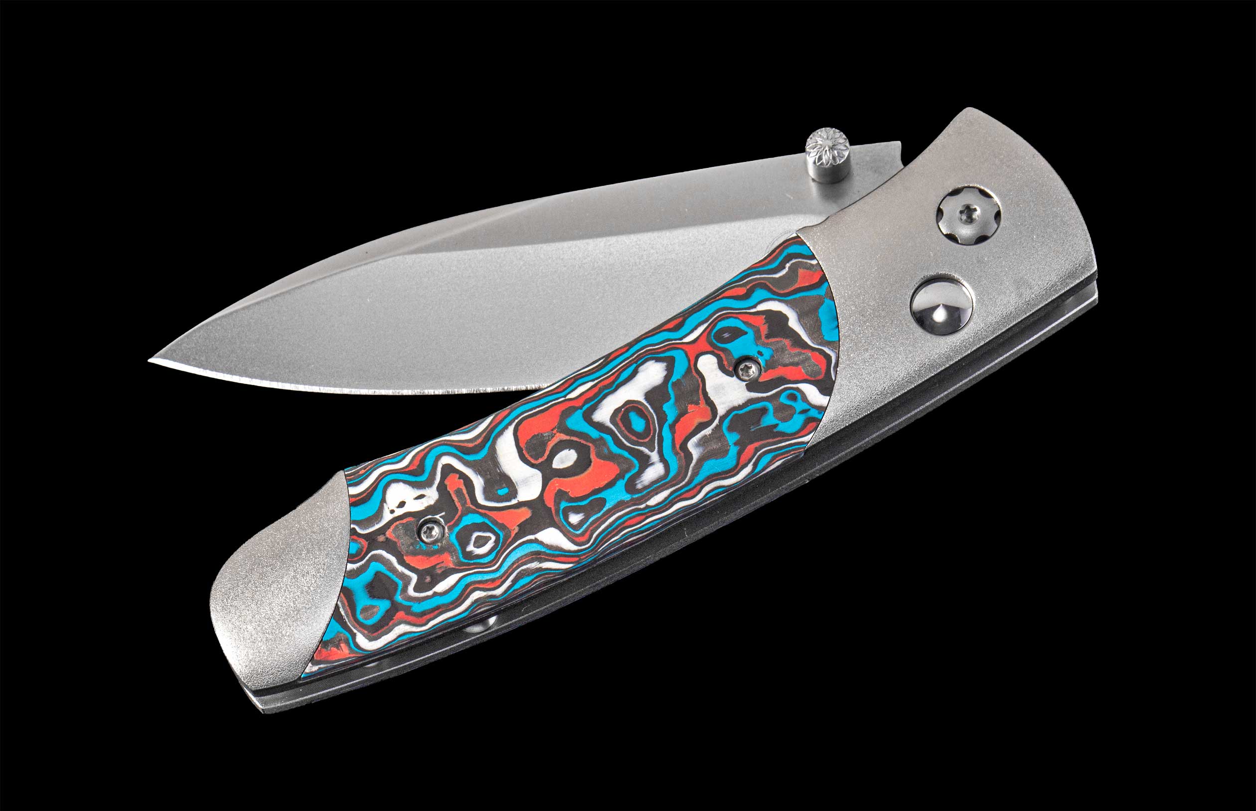 Folding knife with a colorful handle on a black background