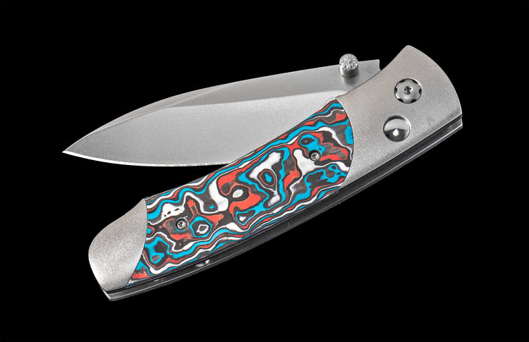 Folding knife with a colorful handle on a black background