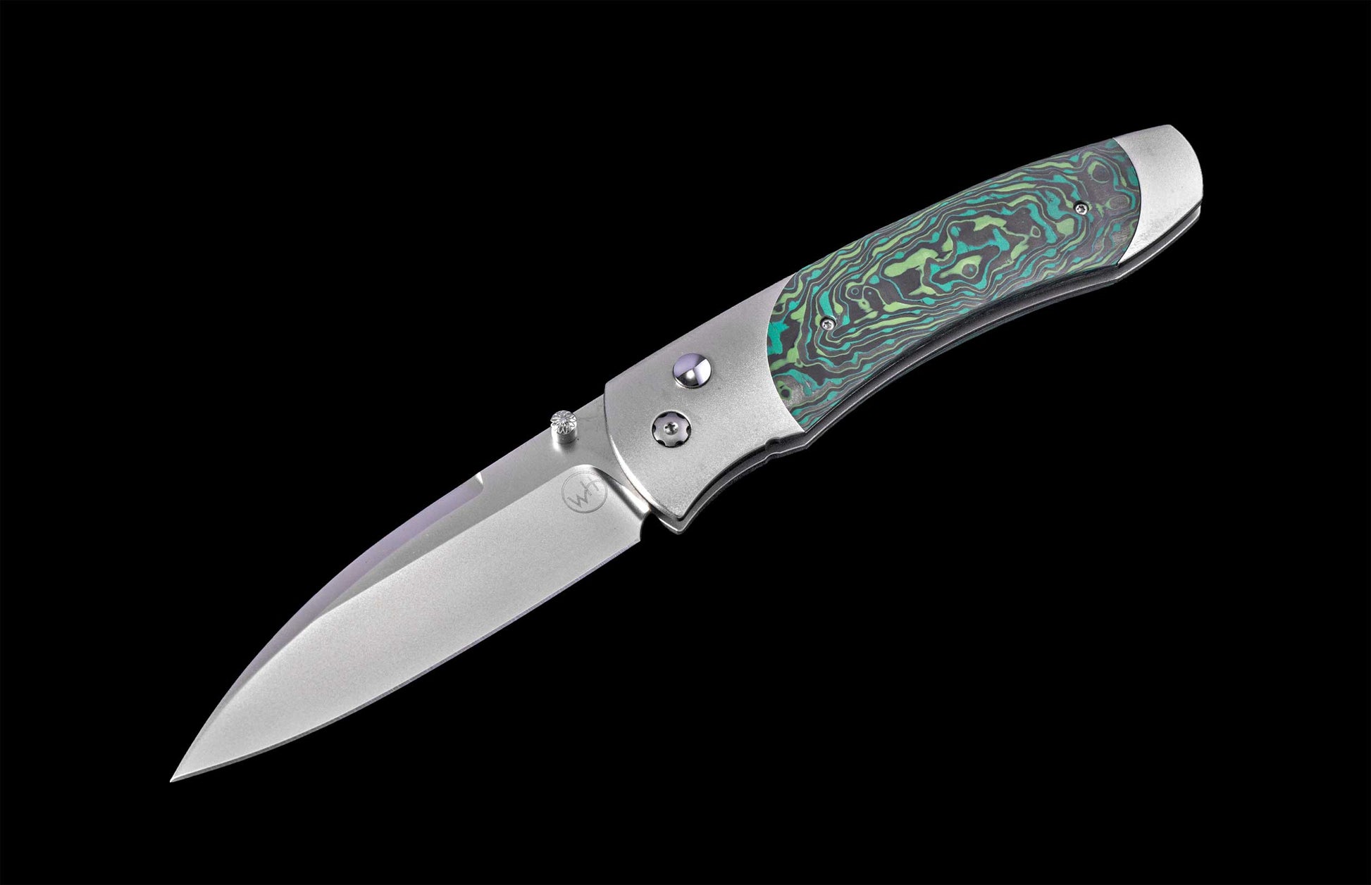 Folding knife with a decorative handle on a black background