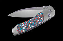 Foldable knife with a colorful handle on a black background