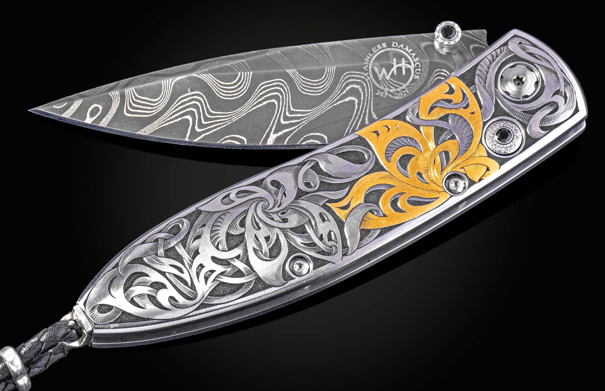 Hand engraved William Henry knife with 24k gold inlays and damascus steel blade