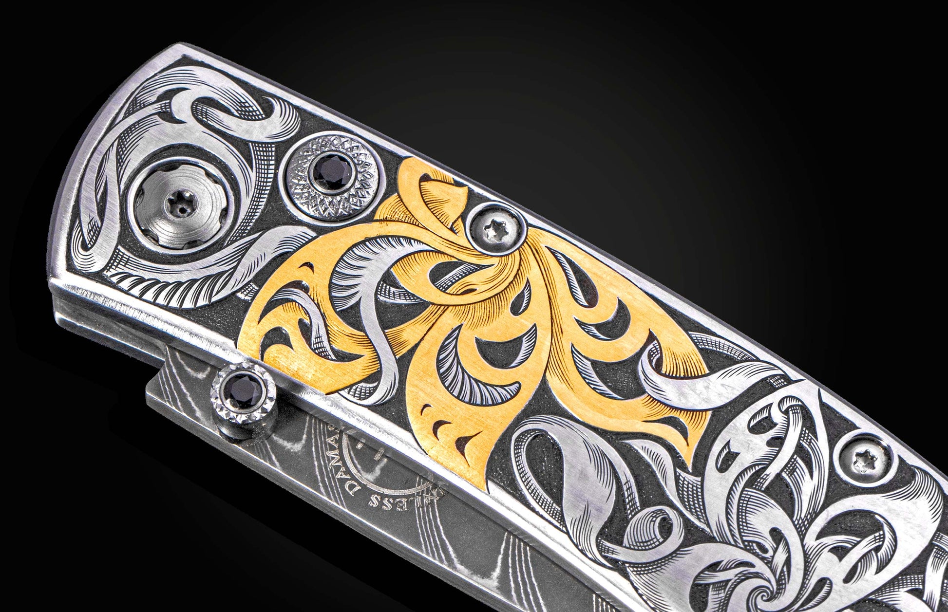 Hand engraved William Henry knife with 24k gold inlays and damascus steel blade