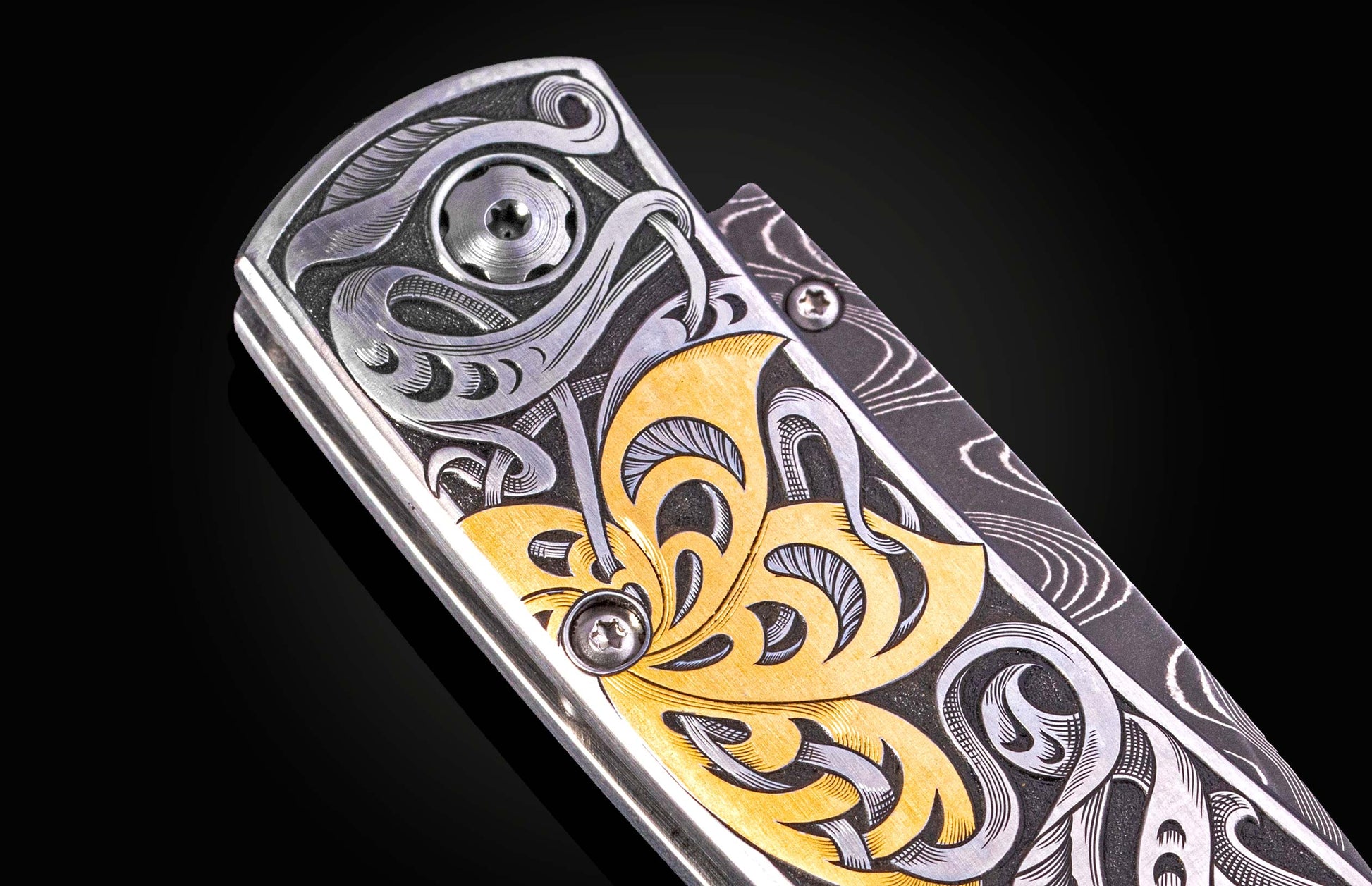Hand engraved William Henry knife with 24k gold inlays and damascus steel blade
