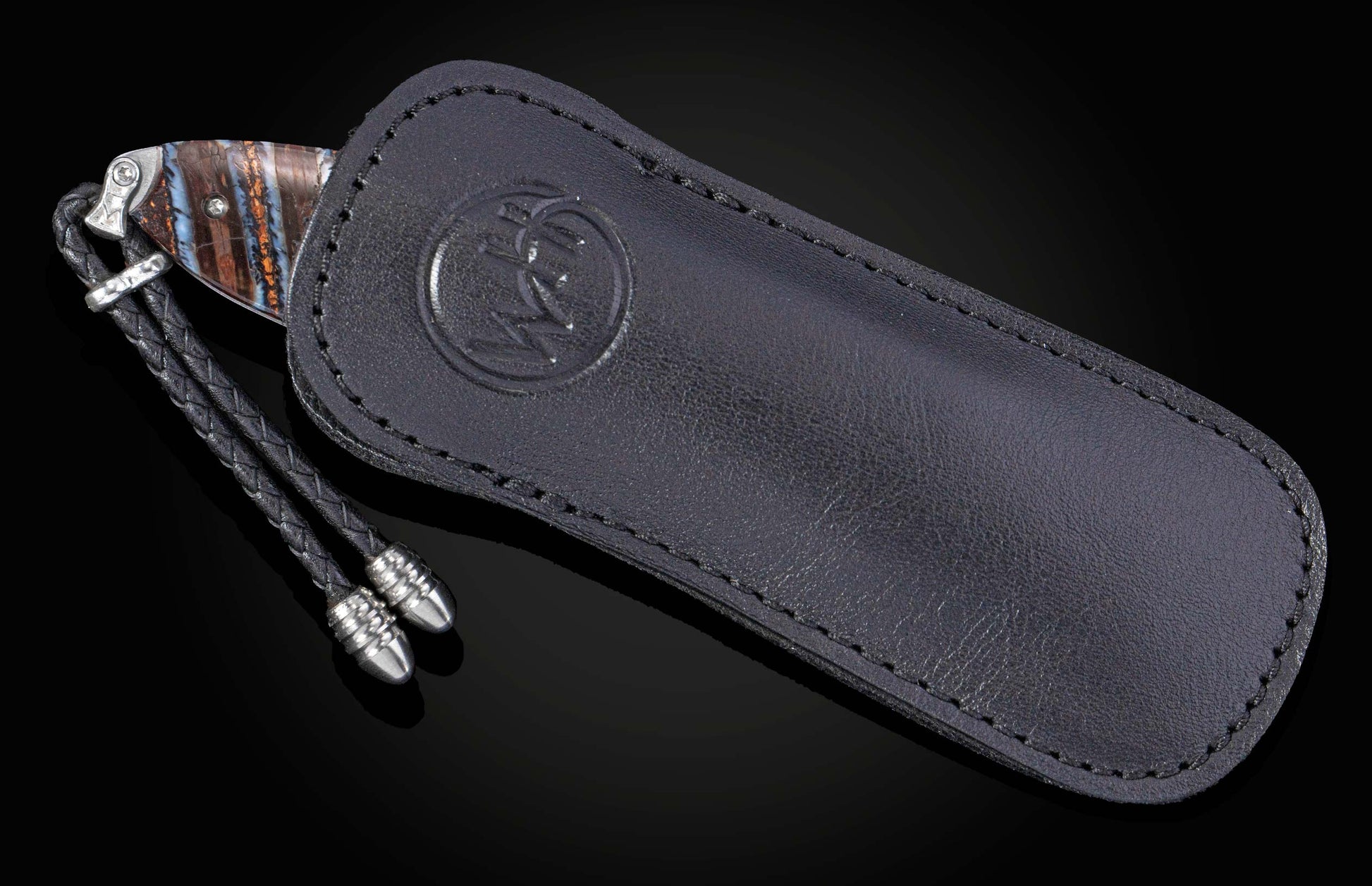 knife with lanyard in black leather case 
