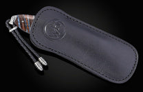 knife with lanyard in black leather case 