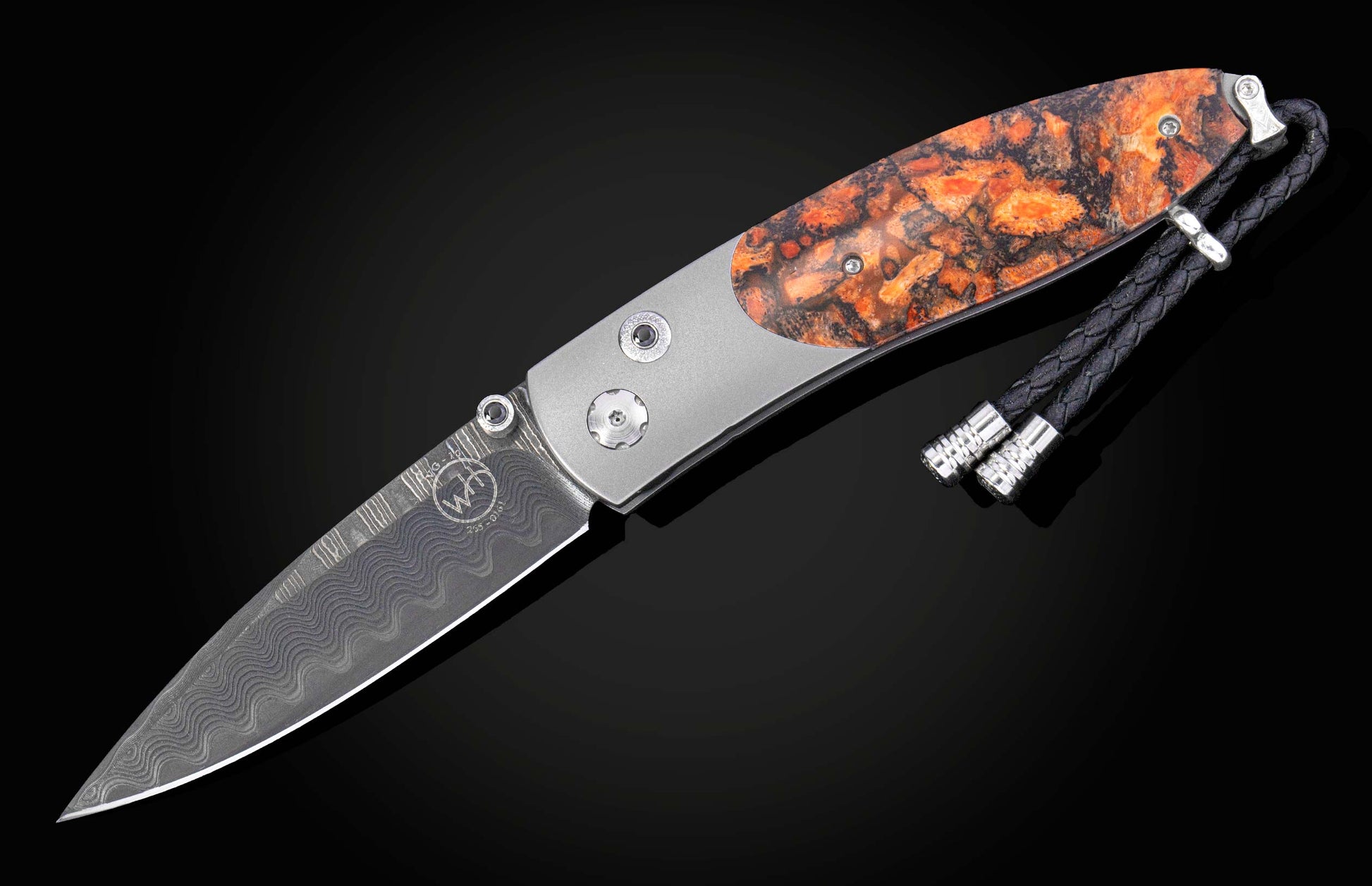 Folding knife with a decorative handle on a black background