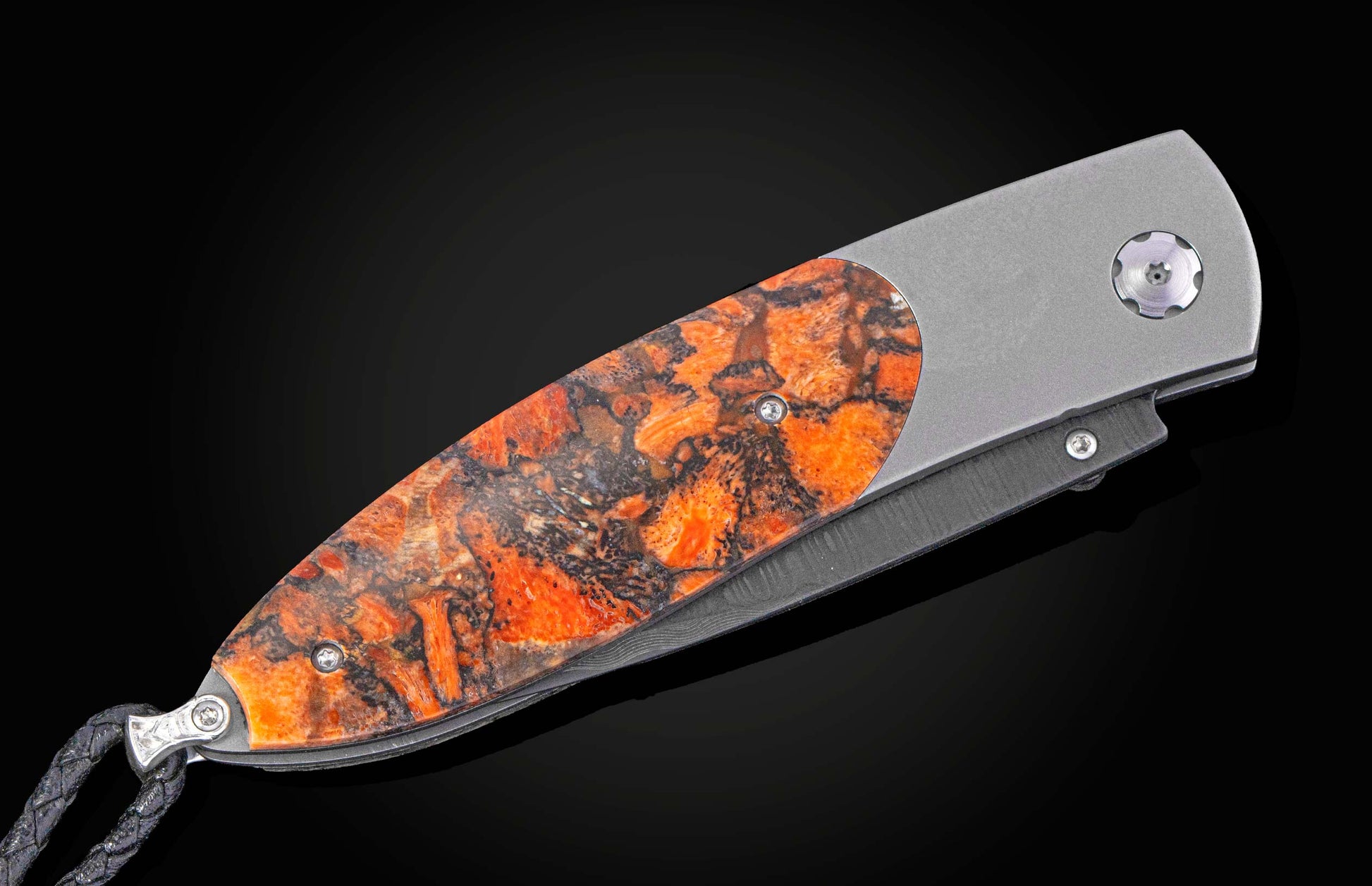 Folding knife with a distinctive blade design on a black background