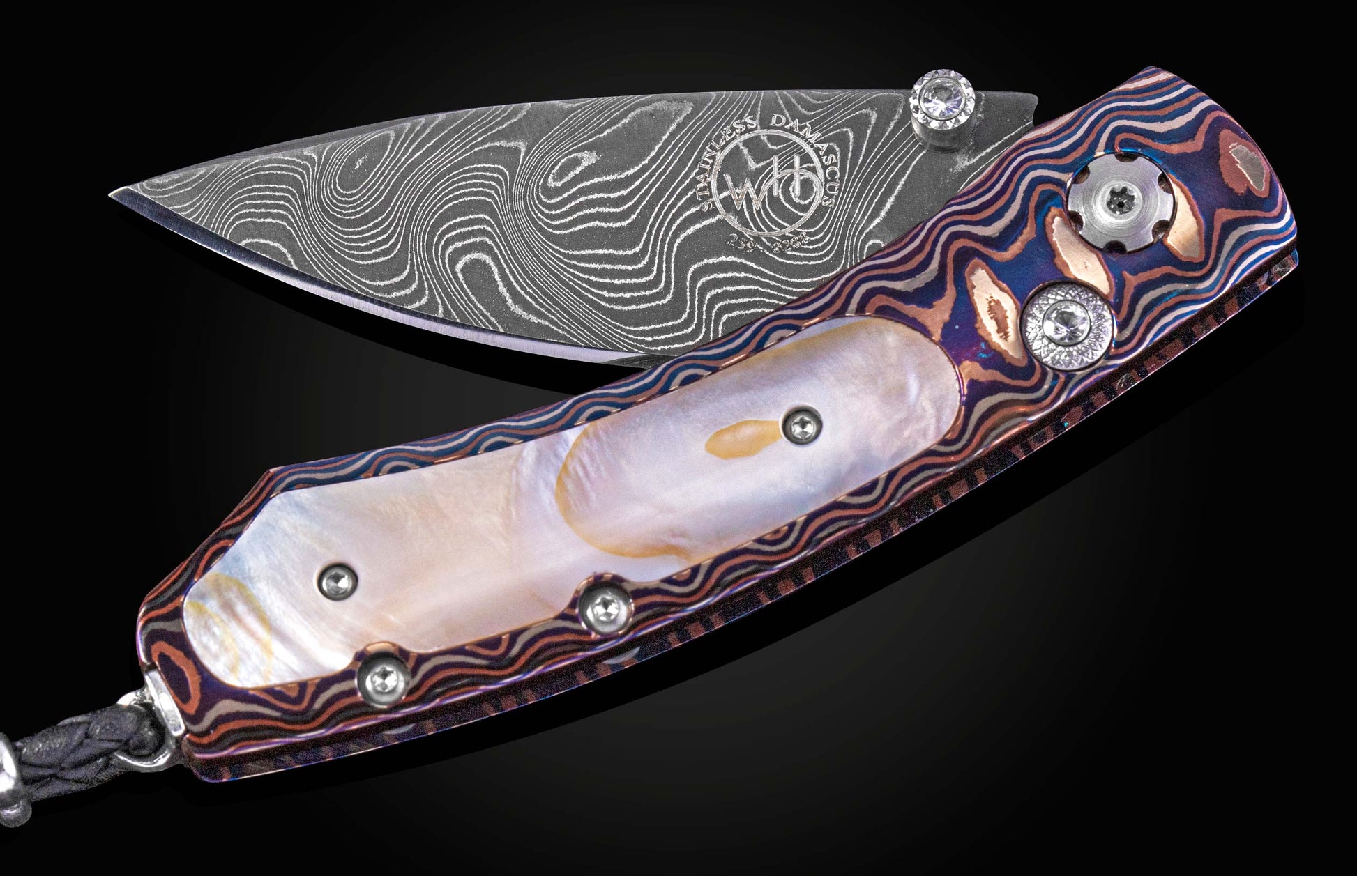 Decorative knife with Damascus blade on a black background