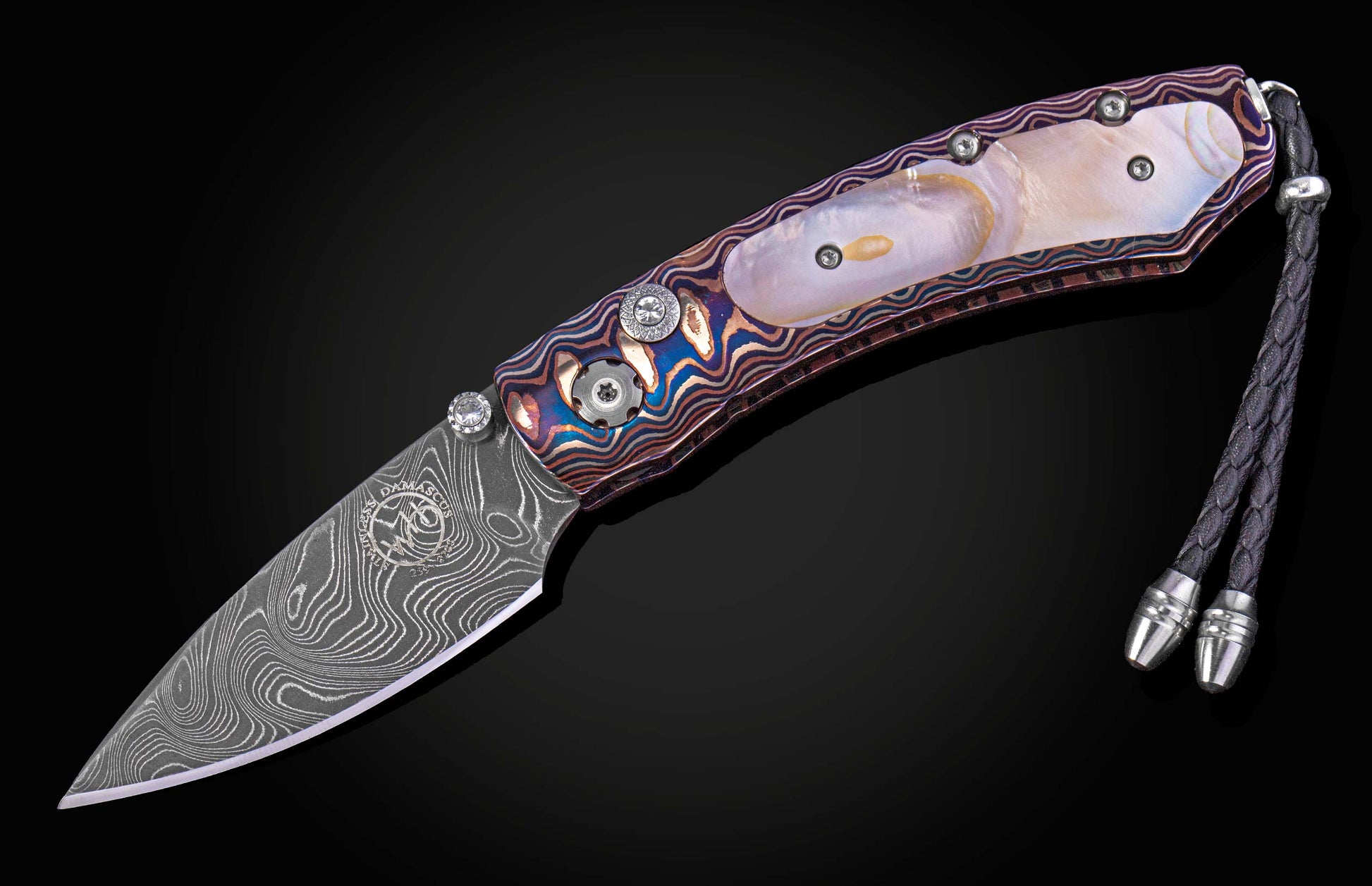 Folding knife with decorative handle on a black background