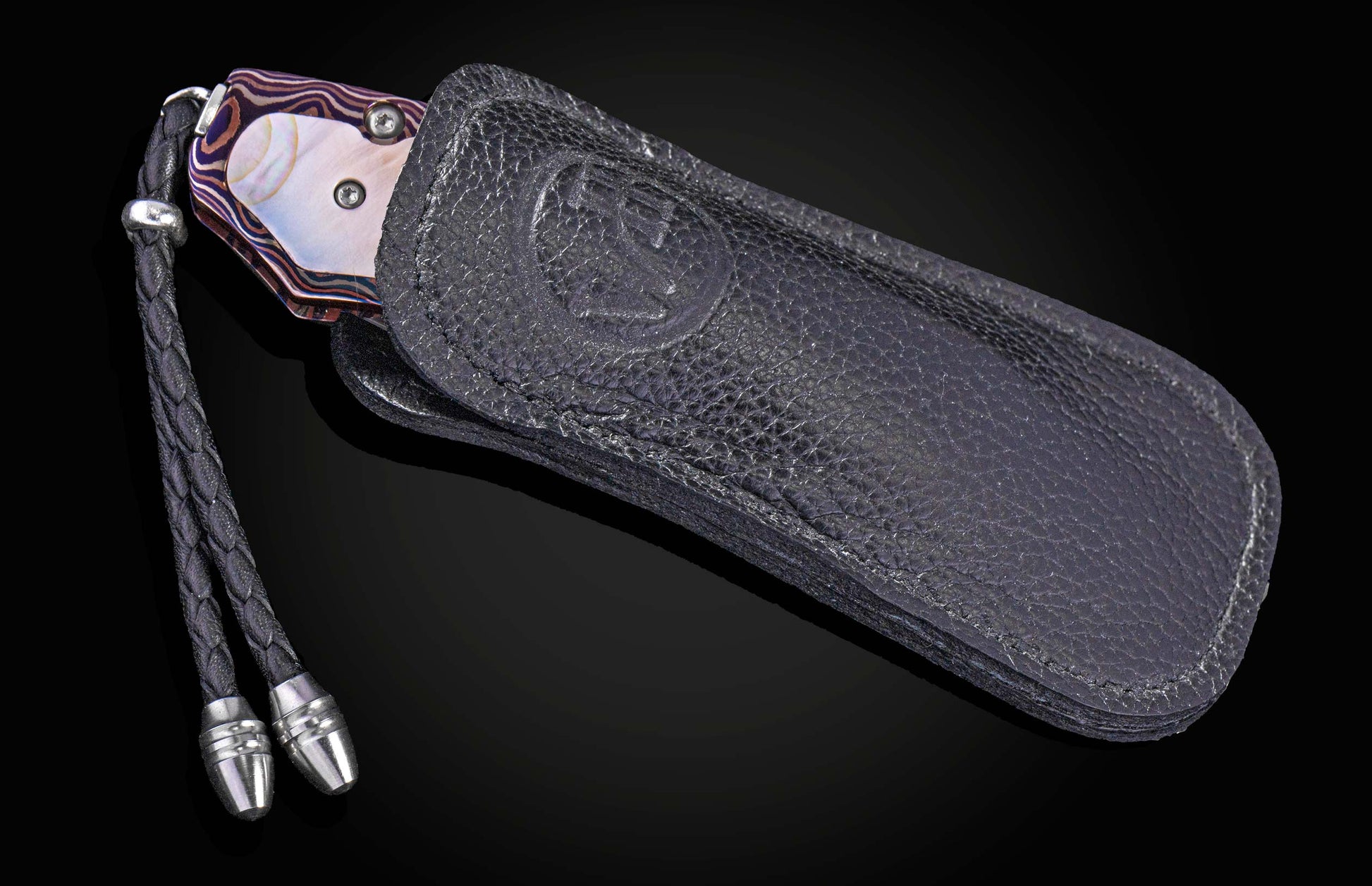 Decorative knife with Damascus blade on a black background