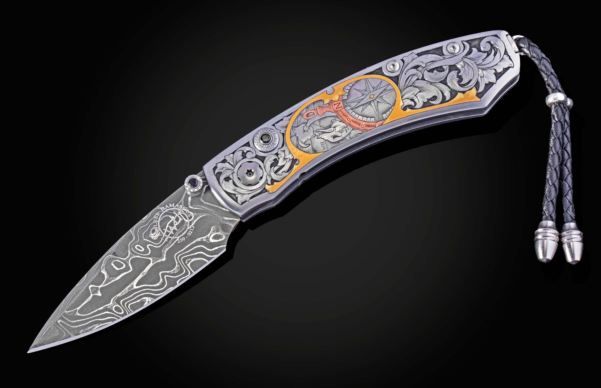 Hand engraved William Henry knife with damascus steel blade