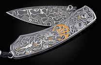 Decorative knife with intricate patterns on a dark background