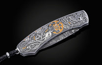 Decorative knife with intricate patterns on a dark background