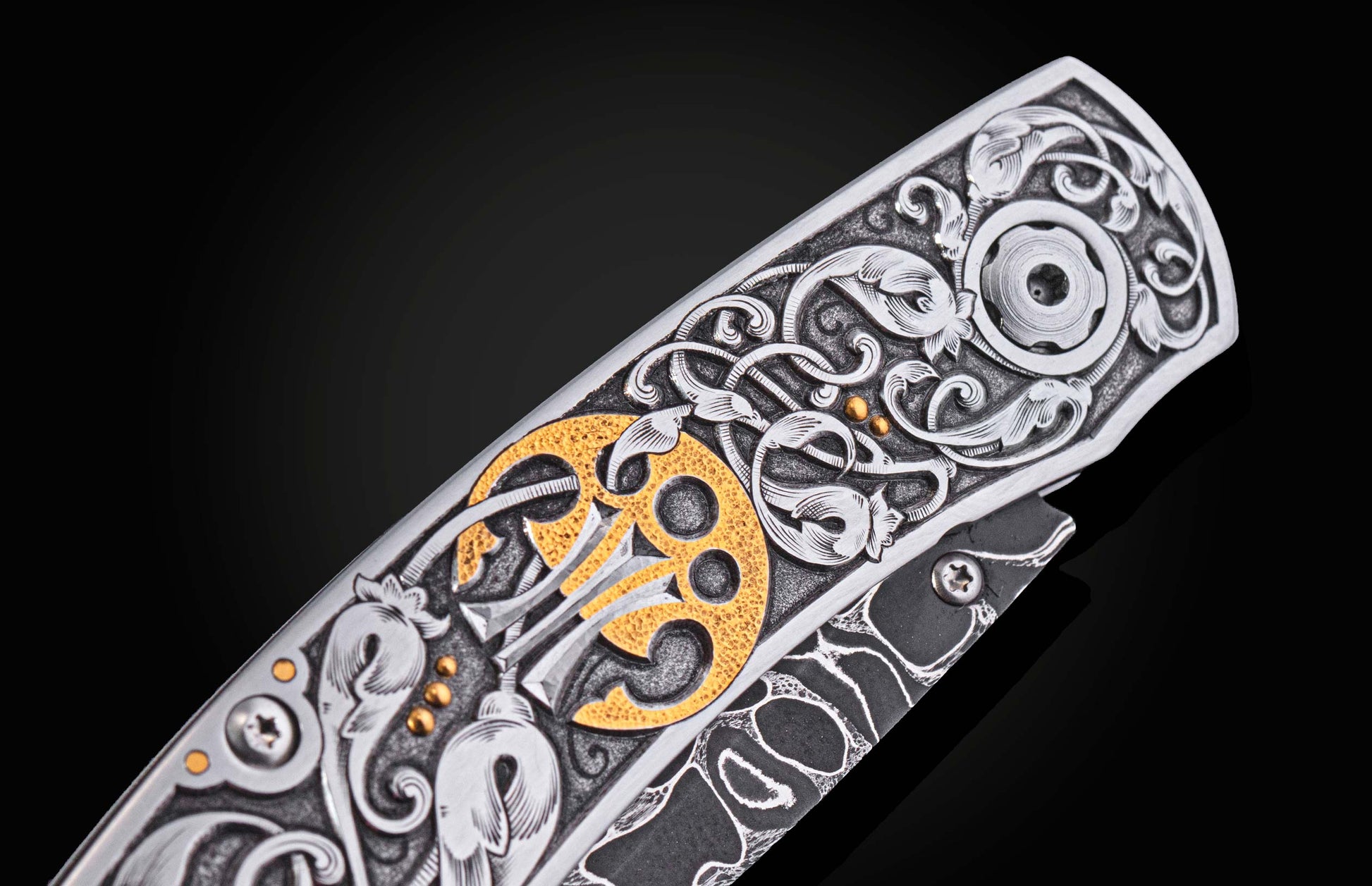 Decorative knife with intricate patterns on a dark background