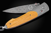 Damascus and titanium folding knife, inlaid with wood from the Gaylord Family Oklahoma Memorial Stadium bleachers