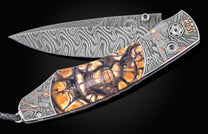 Damascus steel folding knife with amber jasper inlay and P-51 Mustang engraving, side view, luxury design